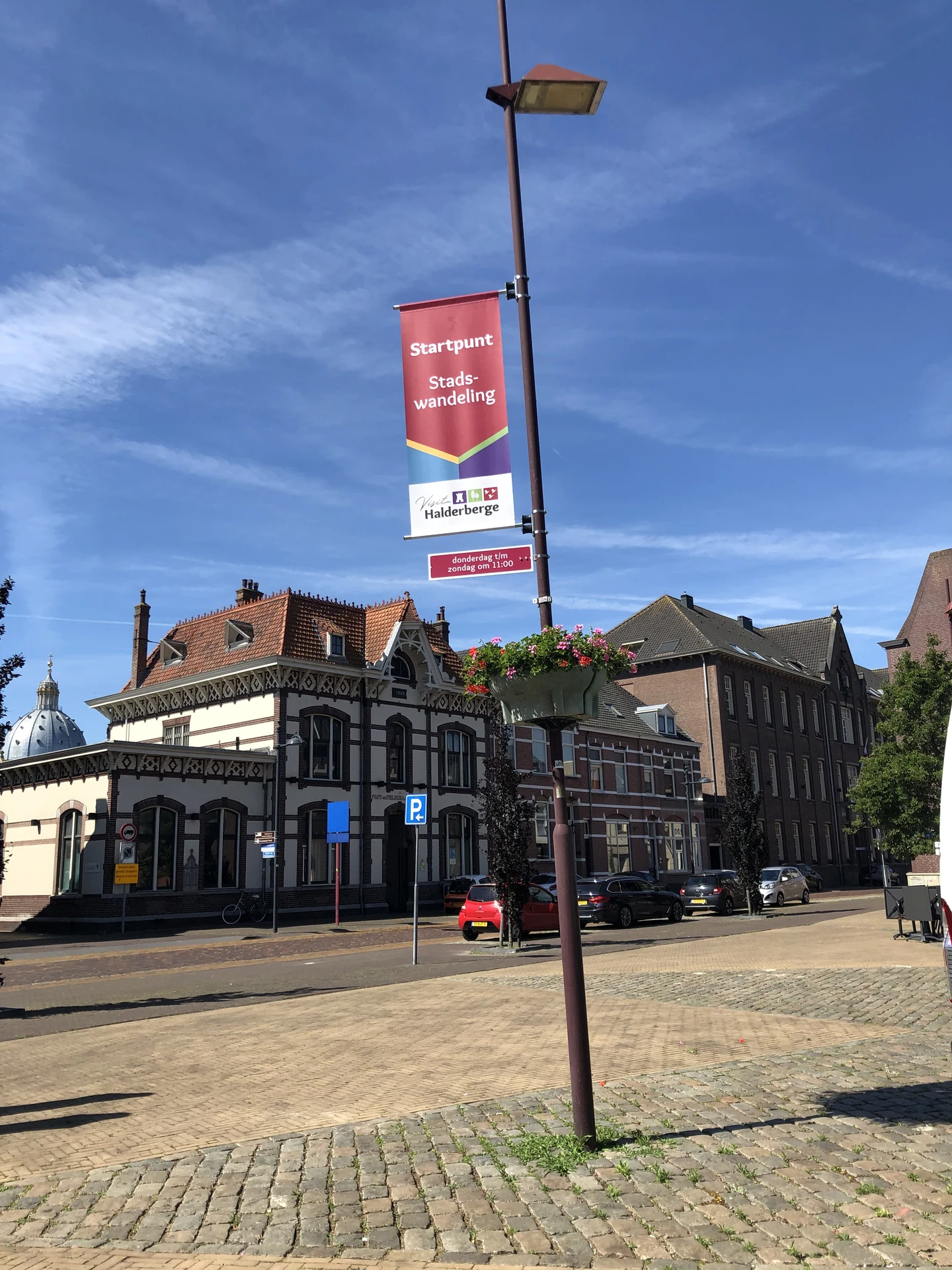 Banner fitted to an existing lamp post in a town centre