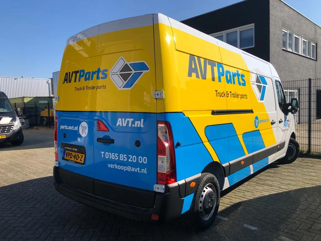 AVT Parts van with yellow and blue brand graphics.