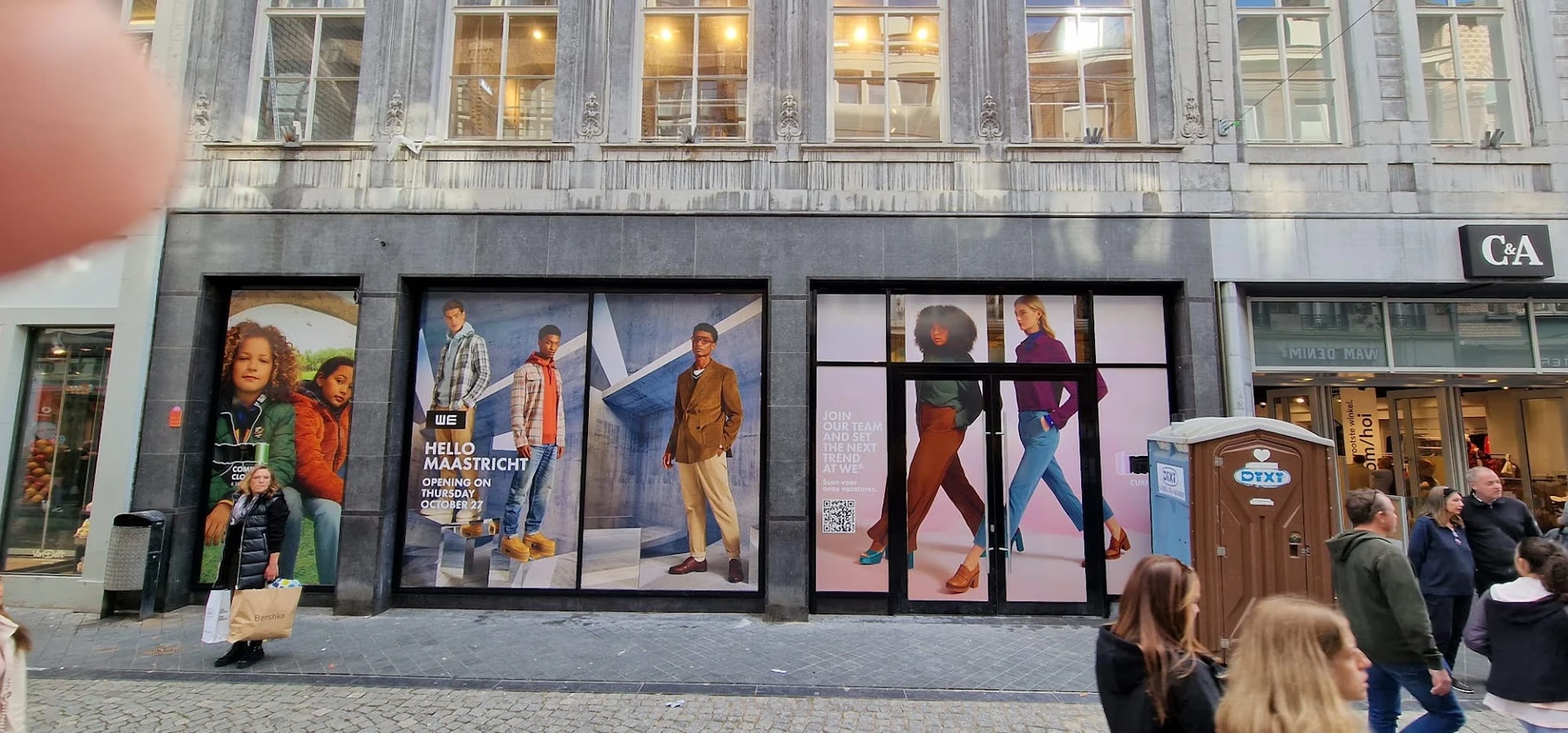 Shopfront with large fashion graphics during the fit-out