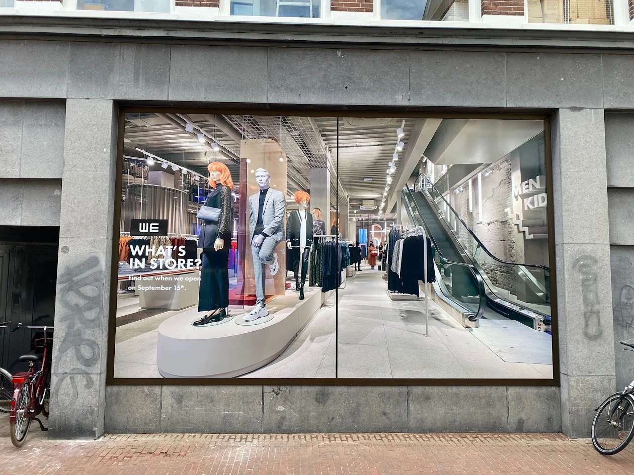 Shop window with a full-colour image of a fashion interior