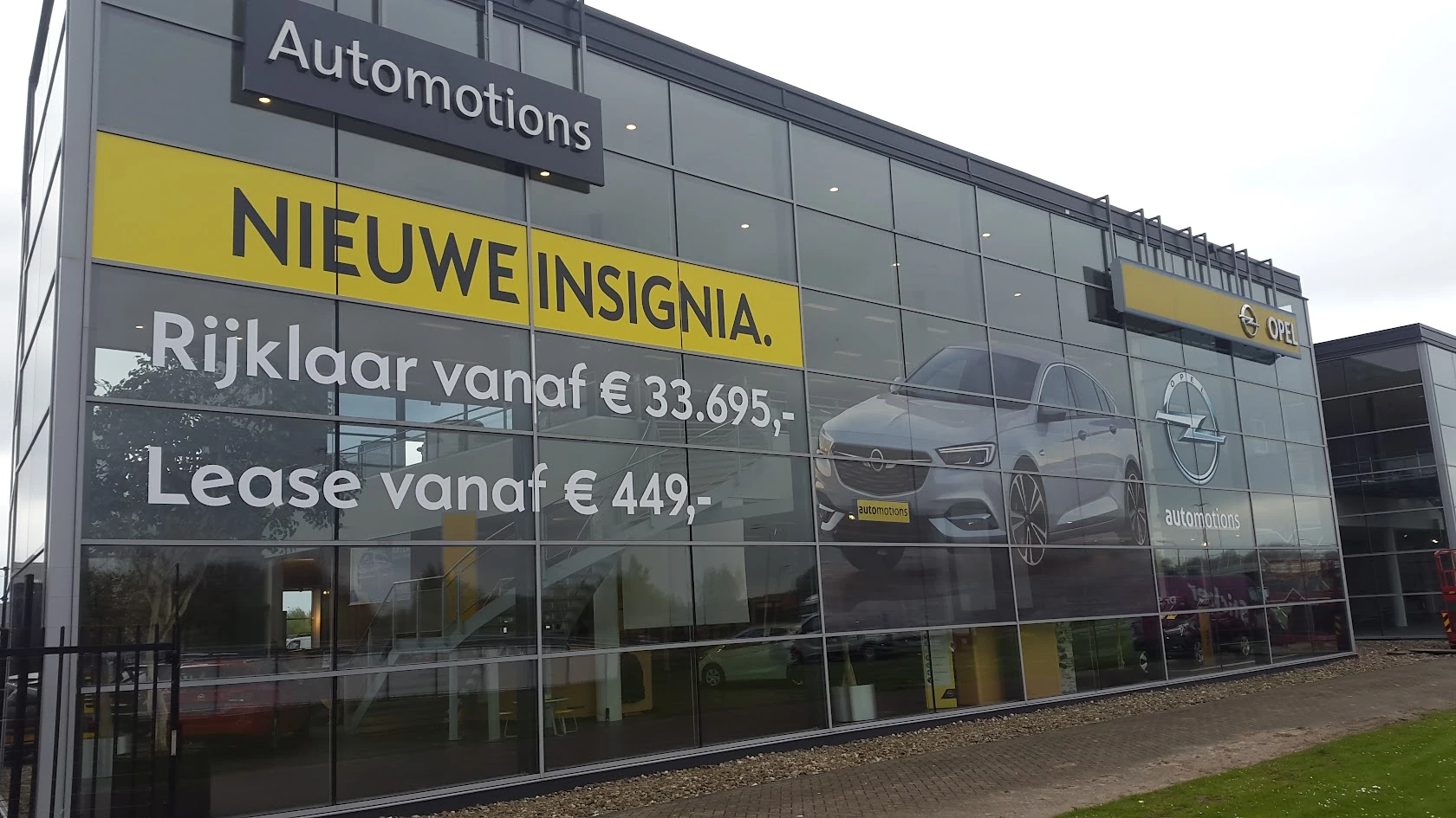 Showroom facade with a car advertising design