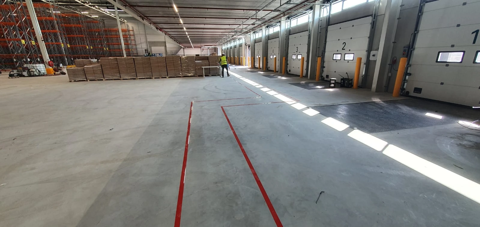 Red floor markings beside numbered loading docks