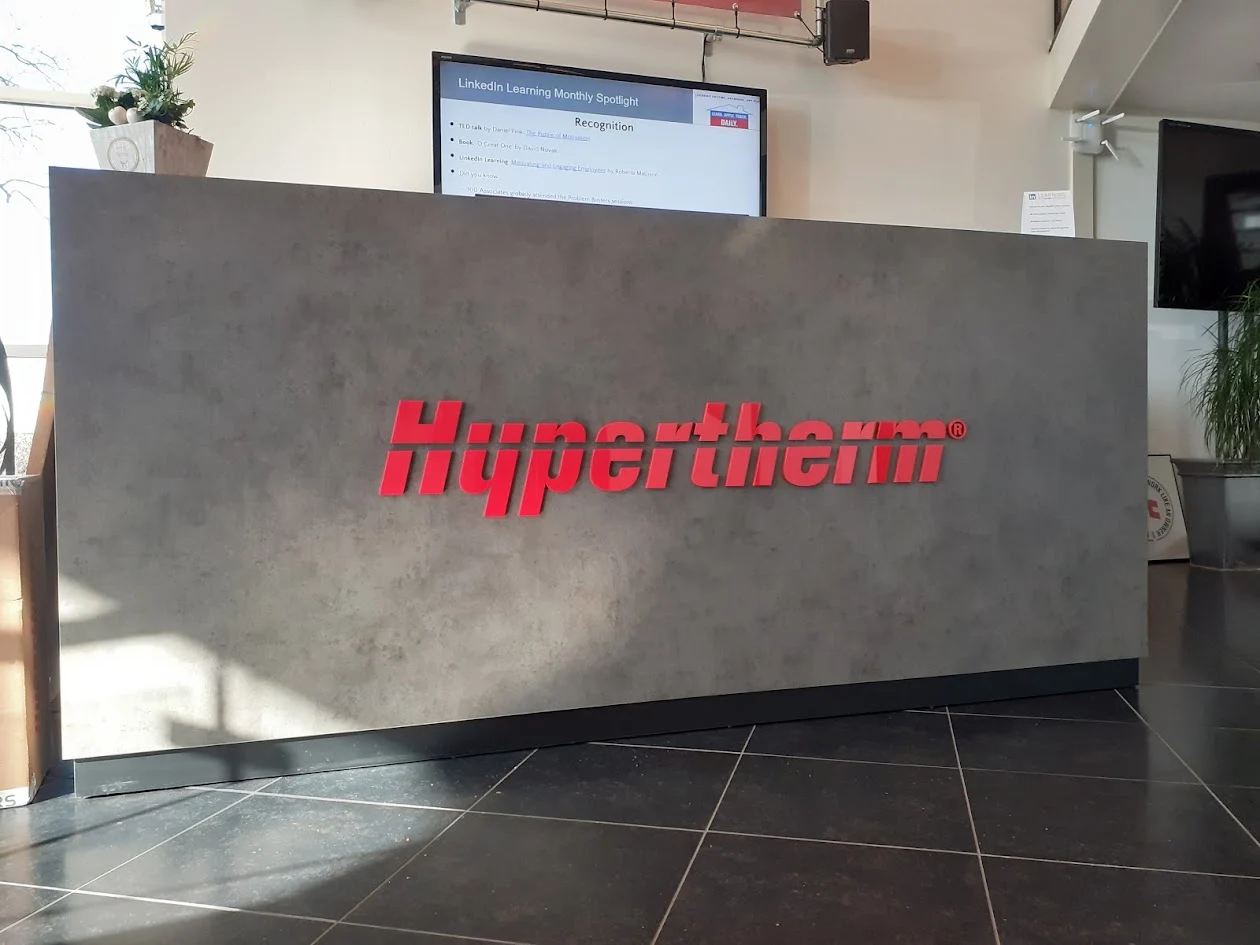 Red logo on a reception desk