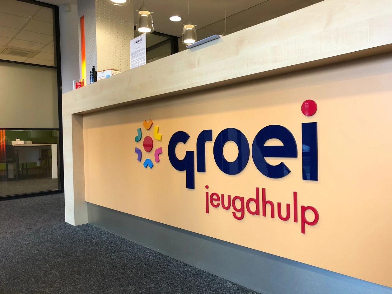 Colourful logo on a reception desk