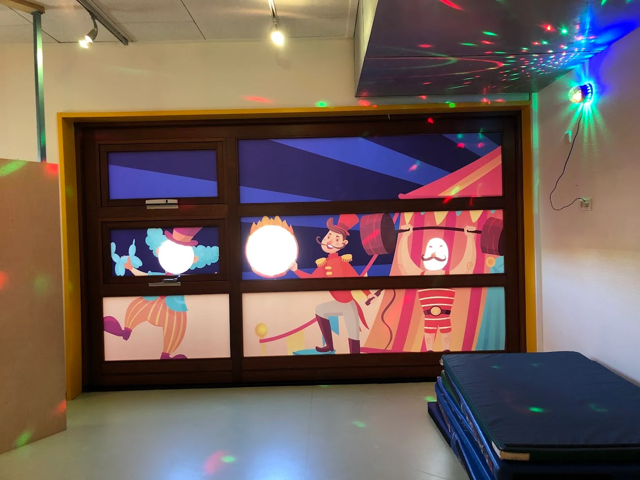 Window film with a colourful circus illustration in a playroom