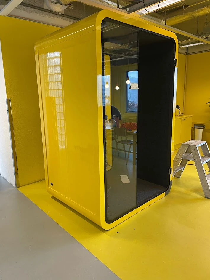 Our project photo of a meeting pod with a yellow finish