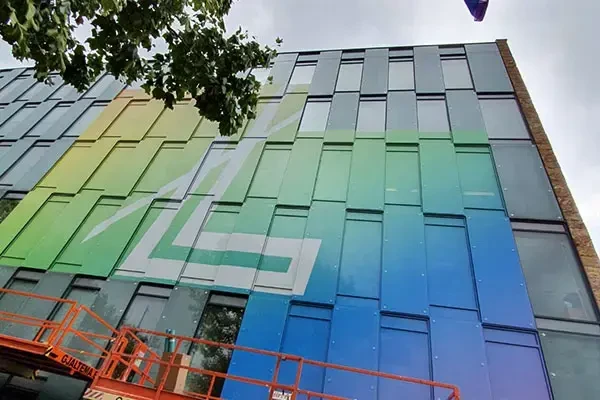 Colourful One Way Vision graphics on an Amsterdam office facade for Pride