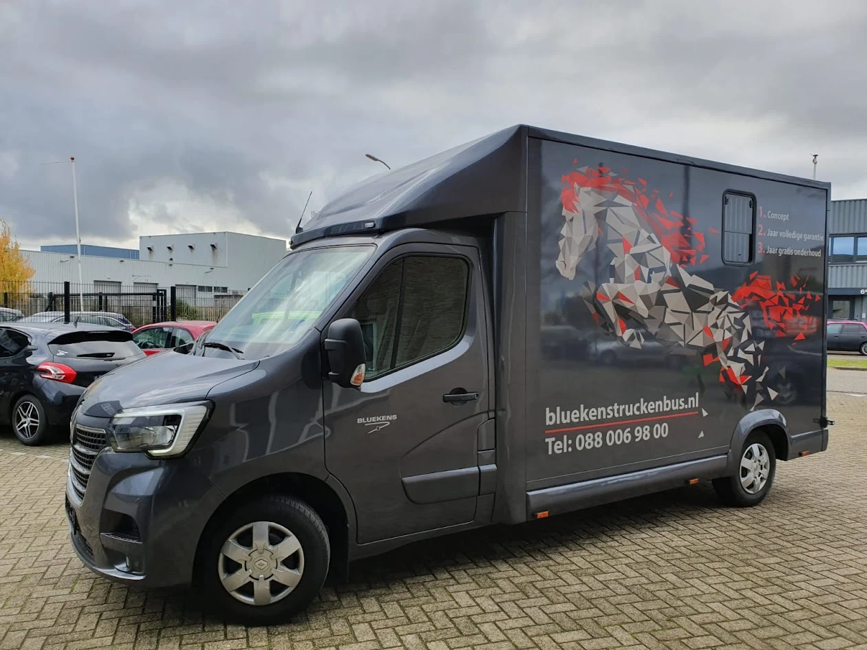 Grey horsebox with a geometric horse and red accents