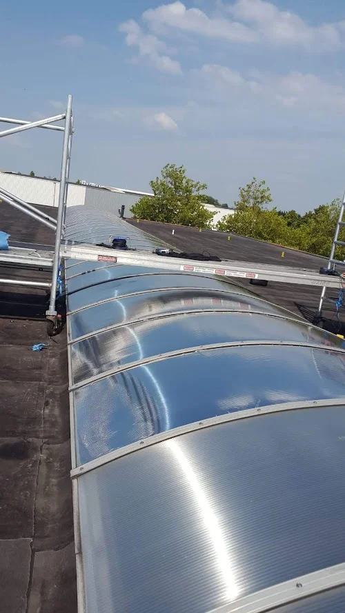 Reflective film applied to a curved rooflight