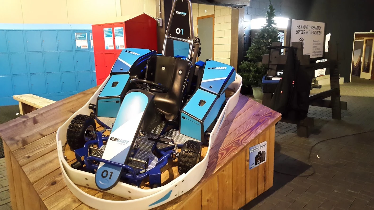 Blue and white ICEKART with graphics on its panels