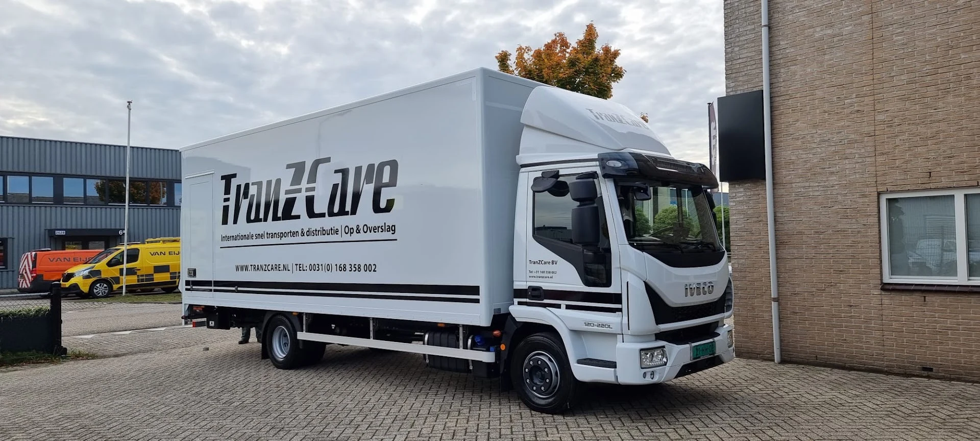 TranzCare lorry with logo, company name and contact details
