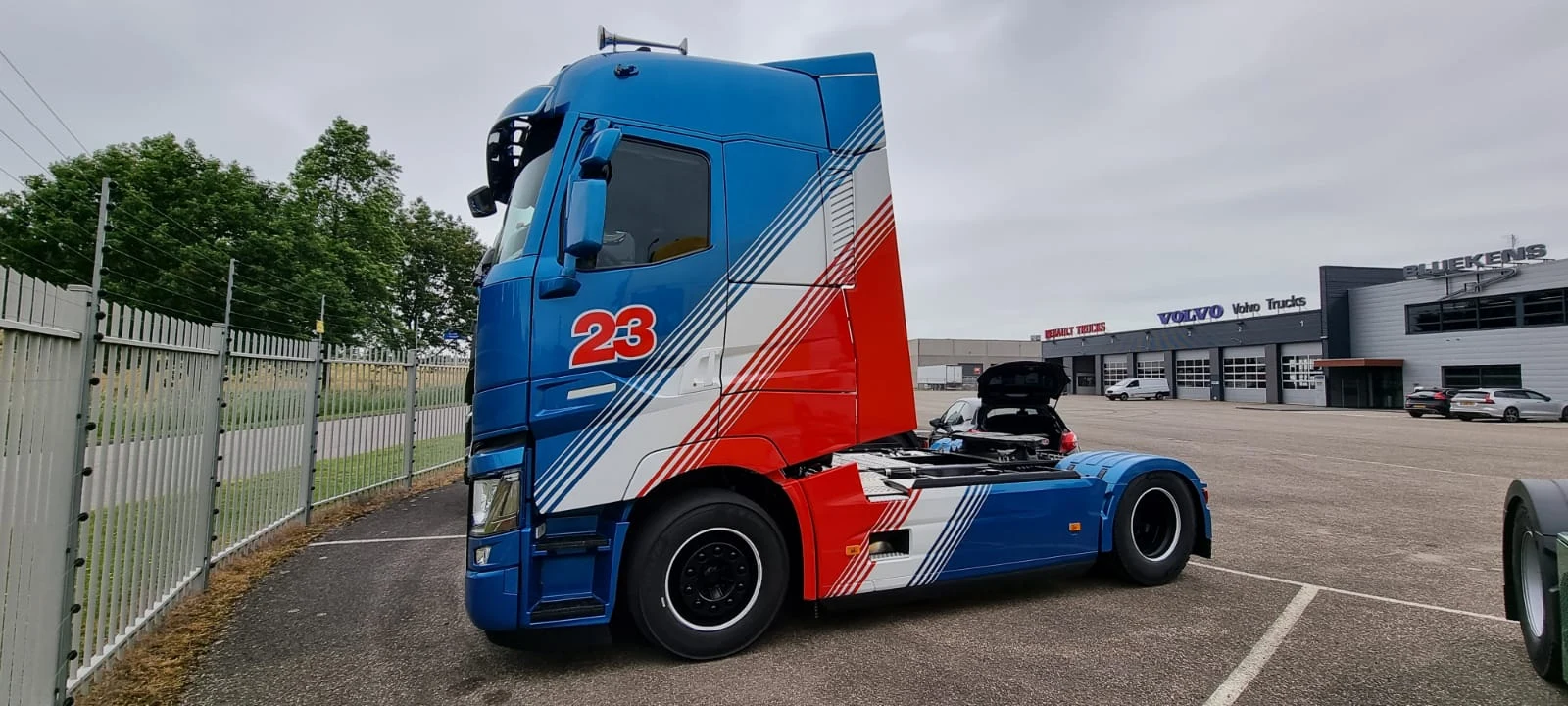 Lorry cab wrapped in blue, white and red