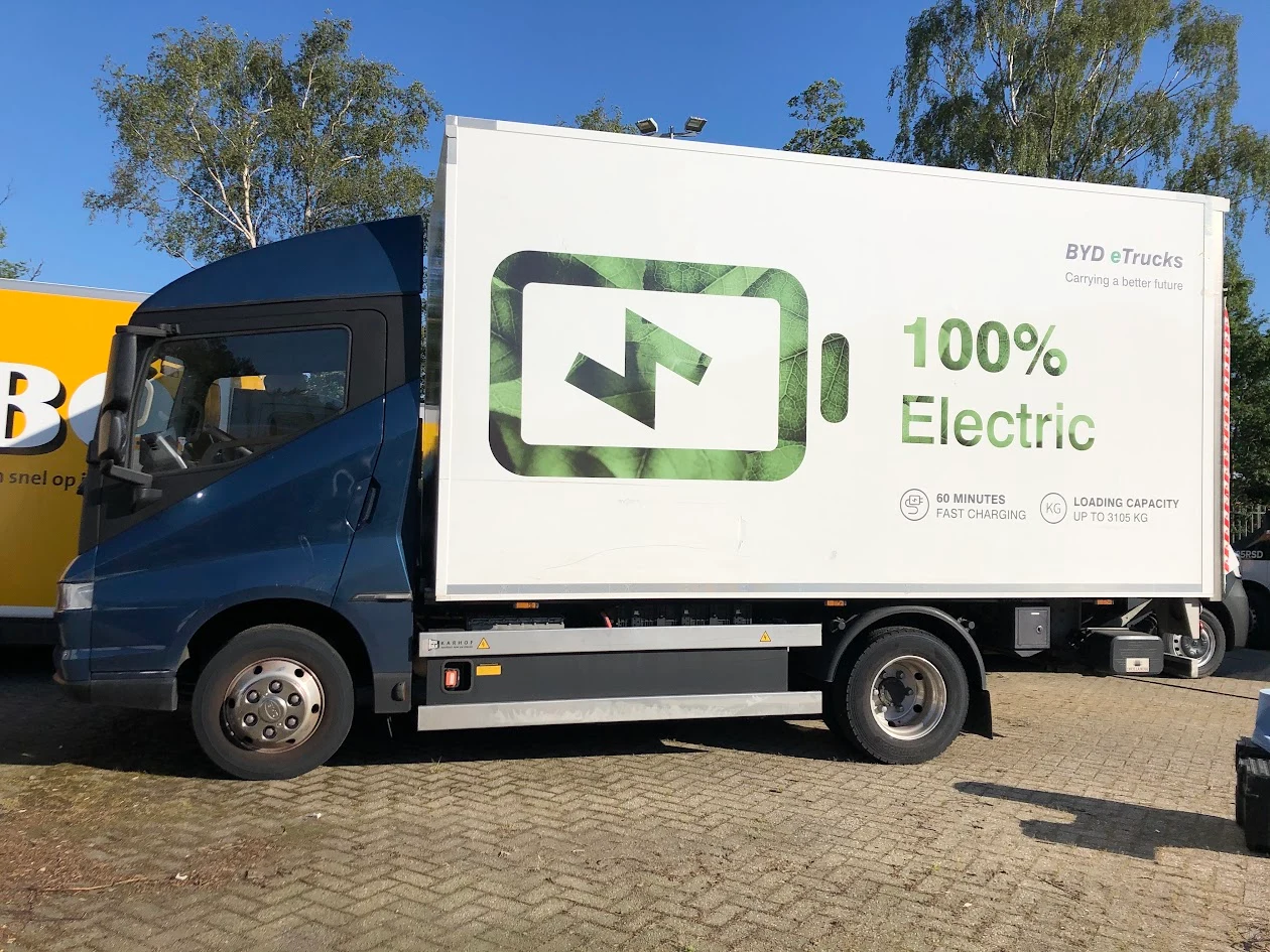 BYD electric lorry with a large green battery design on the box body