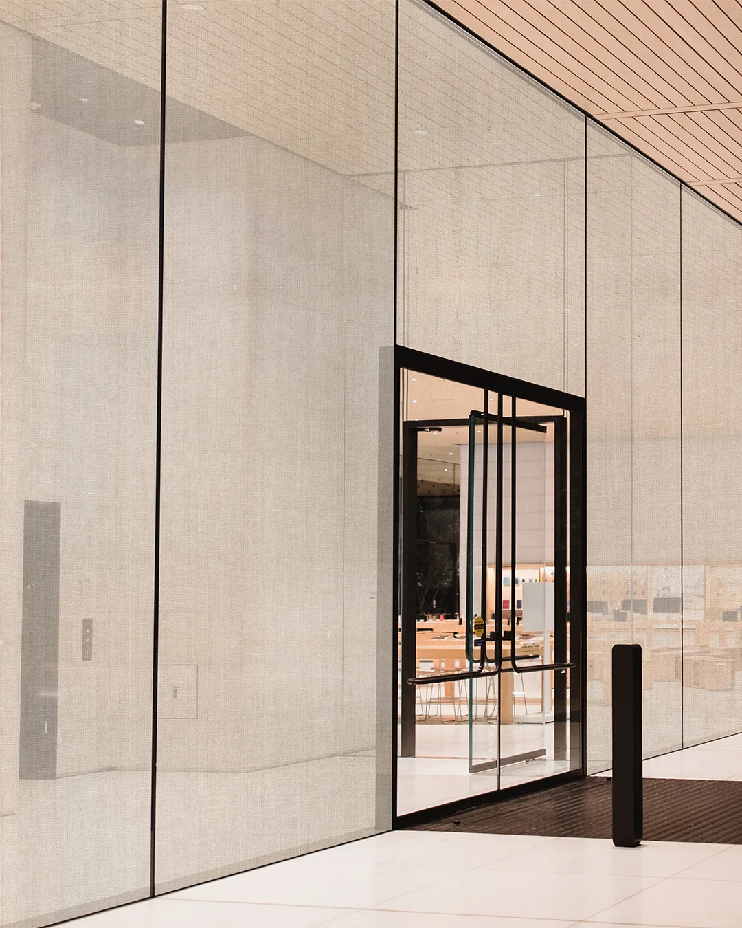 Window textile on glass partitions beside an entrance