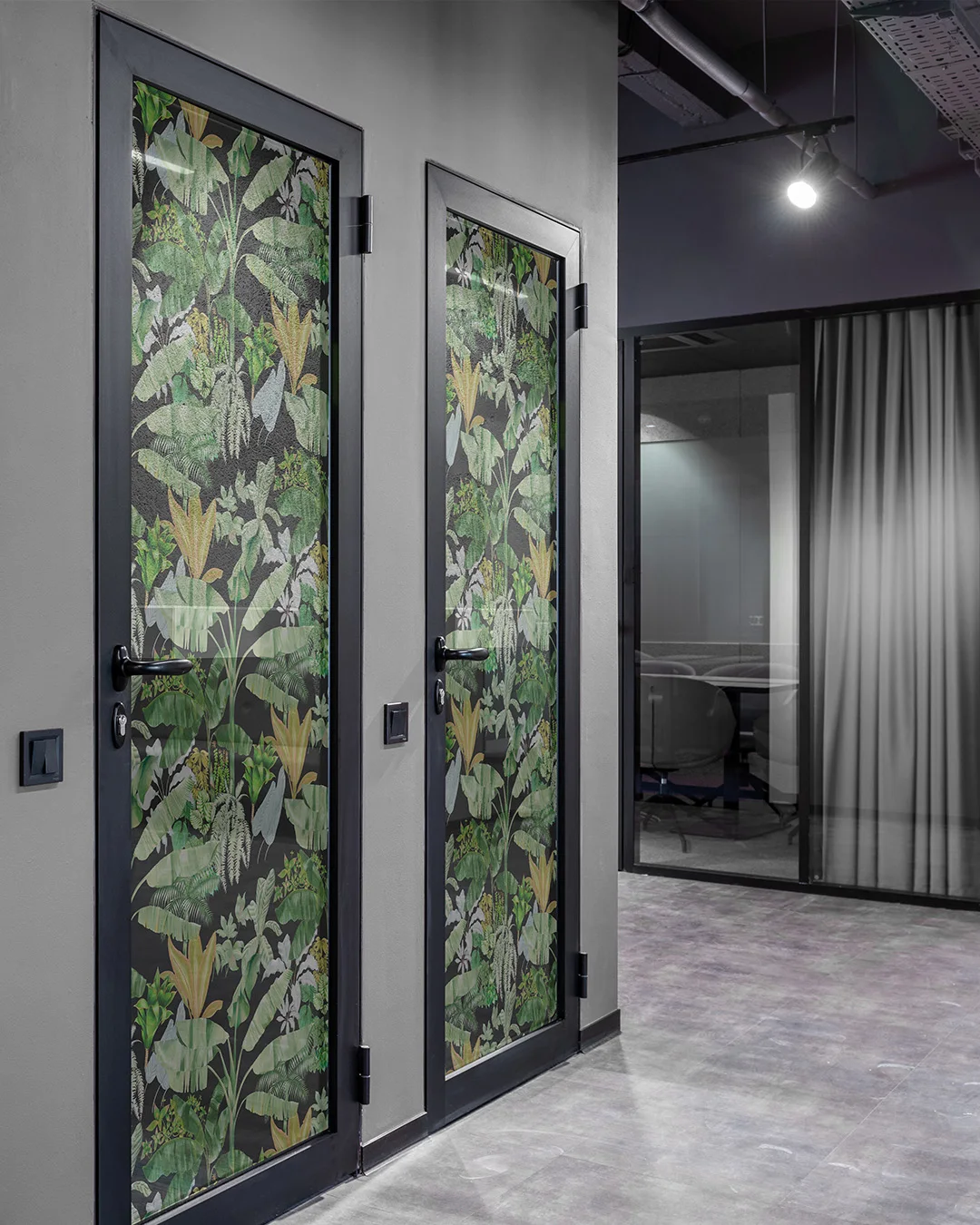 Veilish window textile with a botanical print on glass doors