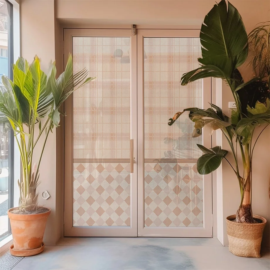 Window textile with a pink graphic pattern on a glass door